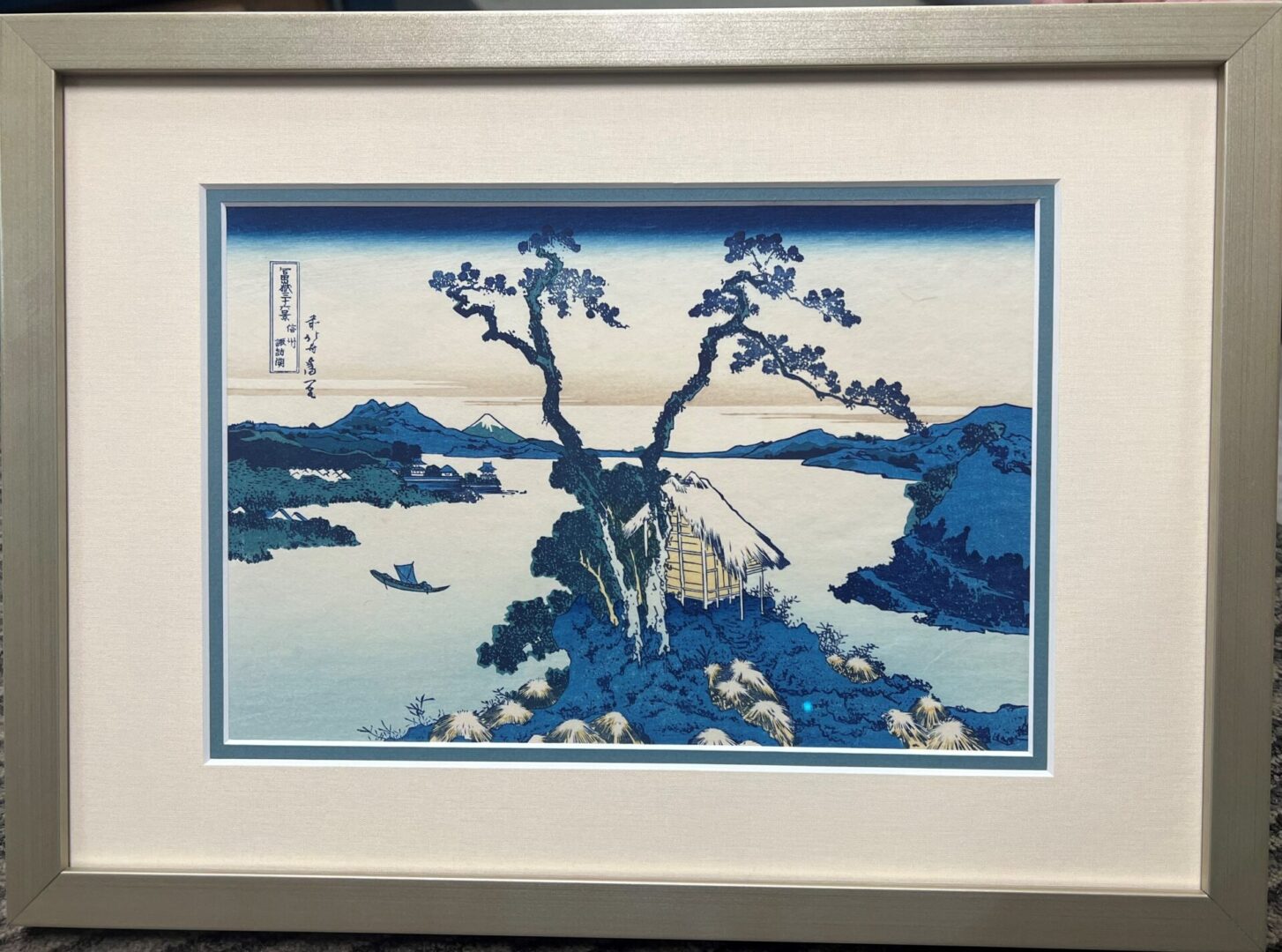 A painting of a tree in the water
