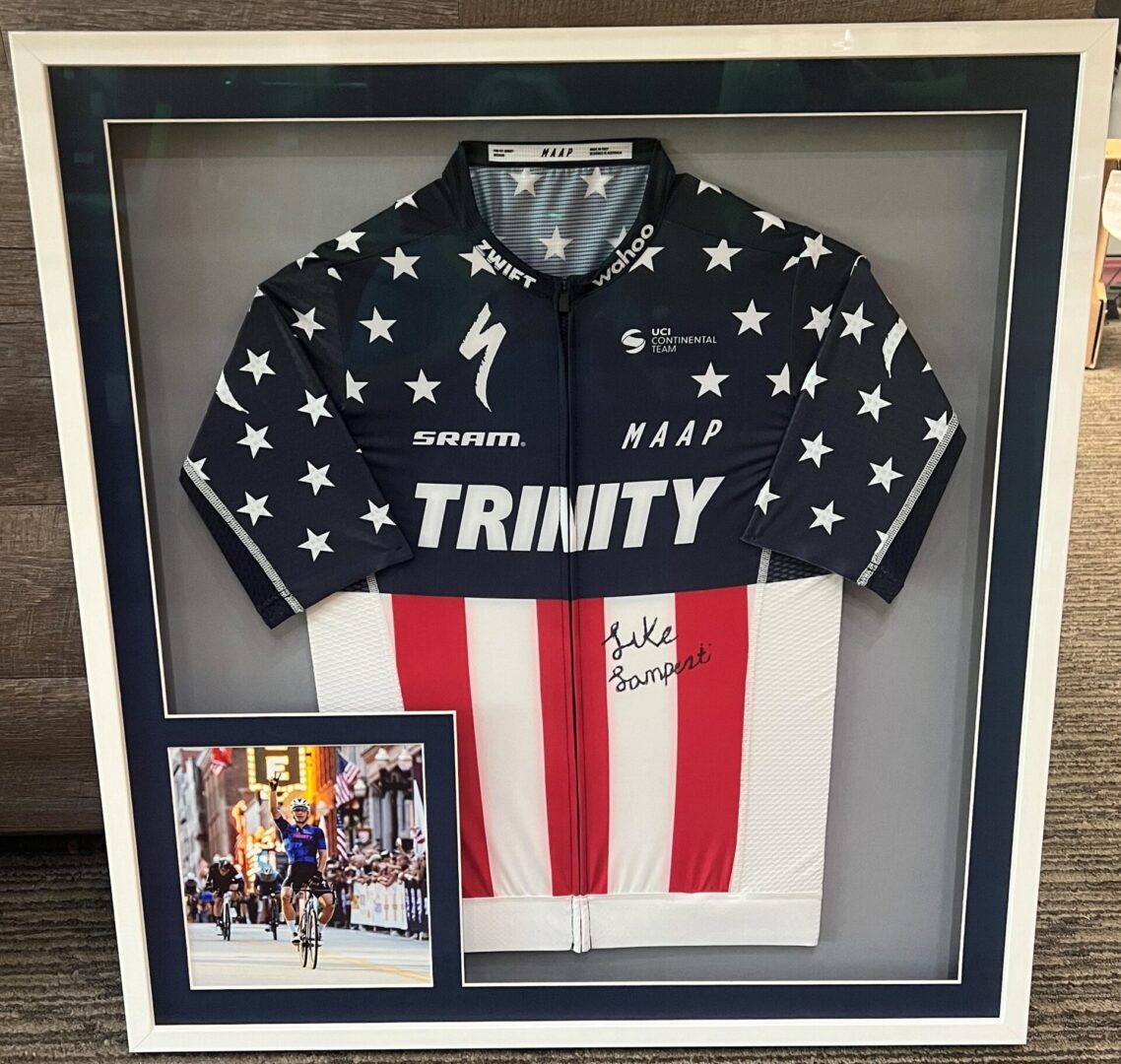 A Framed Trinity Jacket With Signature