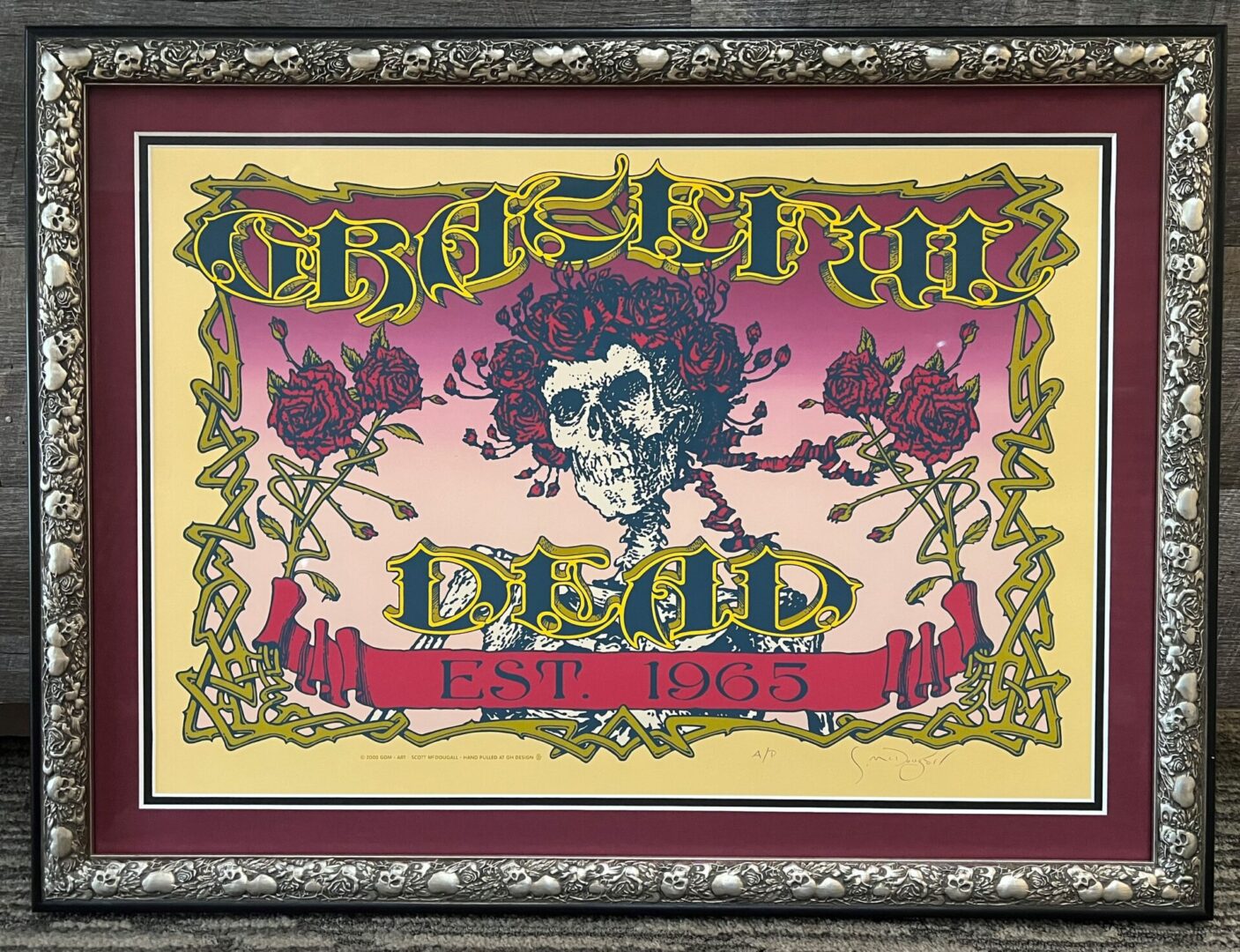 A framed picture of the grateful dead.