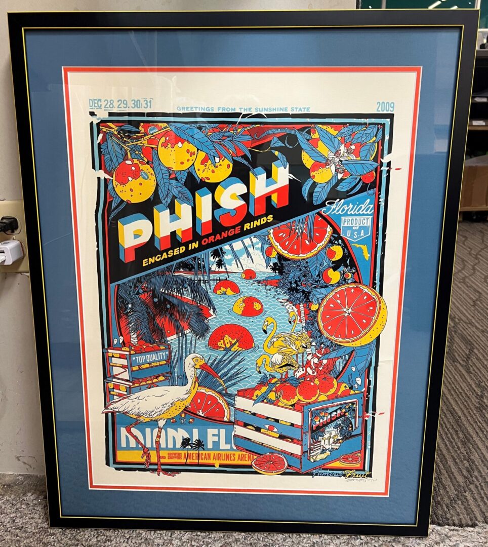 A framed phish poster is shown in the picture.