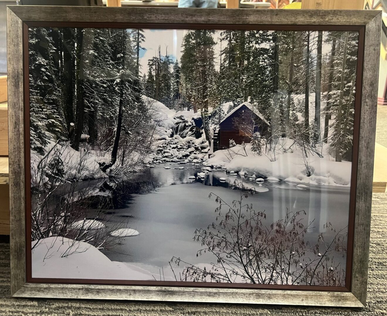 A painting of a cabin in the woods