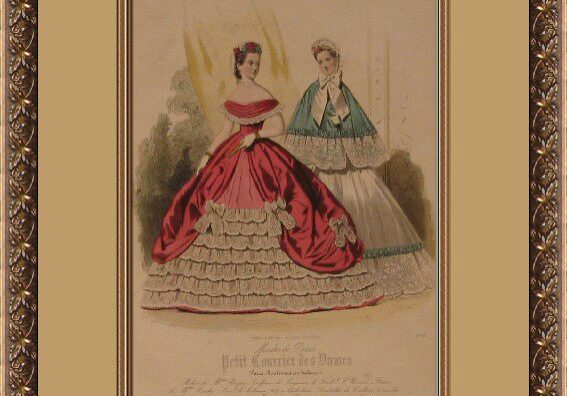 A framed picture of two women in dresses.